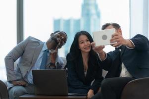 New business group discuss and exchange ideas while relaxing in the office room. photo