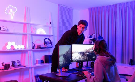 The mood of people waiting to play games when there is only one computer. When the game is over, it's time to switch players. photo