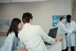 Medical teacher and interns analyzing the x-ray results of the patient's brain. before major surgery in the operating room photo