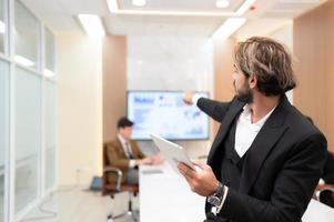 Portrait of young entrepreneurs are enthusiastically taking their ideas and sharing perspectives. In the meeting room of an international business corporation, photo