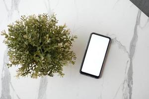 Blank screen cell phone with empty copy space mockup on tiles background , photo