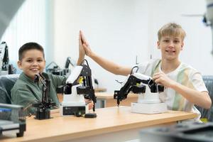 Children using the hand robot technology, Students are studying technology, which is one of the STEM courses. photo