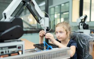 Children using the hand robot technology, Students are studying technology, which is one of the STEM courses. photo