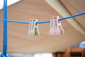 clothespins hanging on a rope photo