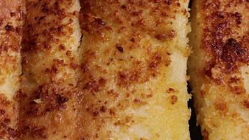 Delicious garlic pizza slices with tasty cheese falling from rotation video