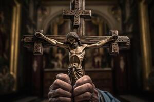 Church priest holds religious cross in hands. photo