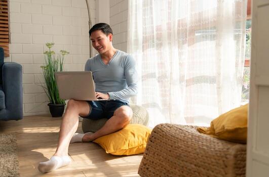 LGBT Young men use computers to communicate with their peers. on the days at home cannot go out. photo
