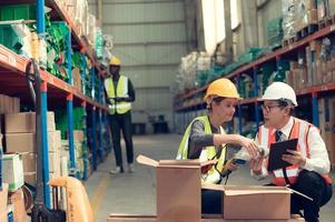 Before exporting to other nations, The product owner meets with the foreman and warehouse personnel to verify their own items held at this warehouse. photo