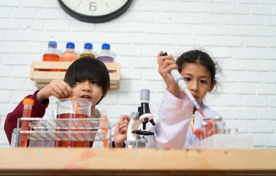 Little boy and girl in science classroom It is the basis for the process of systematic thinking, reasoning, observation, data collection. as well as analysis for processing photo
