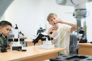 Children using the hand robot technology, Students are studying technology, which is one of the STEM courses. photo
