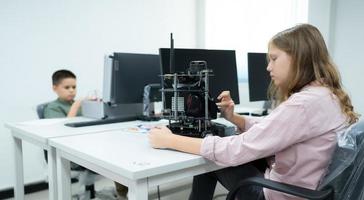 Children using the hand robot technology, Students are studying technology, which is one of the STEM courses. photo