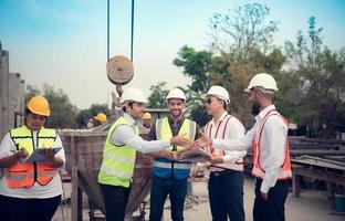 Architects a visit to the construction site. Ready to talk the progress of construction projects in the construction area with construction supervision engineers. photo