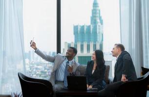 New business group discuss and exchange ideas while relaxing in the office room. photo