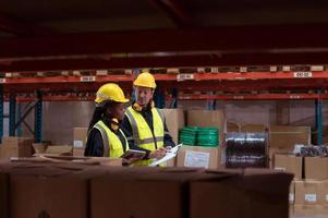 Warehouse foreman and employees Check the imported products in the central warehouse. before delivering to each region's distribution centers photo