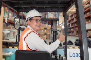 Warehouse manager Examine the equipment used to move goods in the warehouse and test drive a forklift. photo