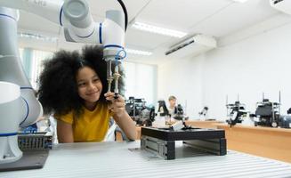 Children using the hand robot technology, Students are studying technology, which is one of the STEM courses. photo