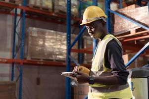 Portrait of warehouse workers in a large warehouse with their own preparation for the day's work photo