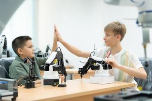 Children using the hand robot technology, Students are studying technology, which is one of the STEM courses. photo