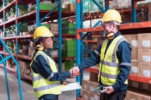 Warehouse foreman and employees Check the imported products in the central warehouse. before delivering to each region's distribution centers photo