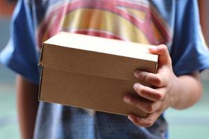 empty brown cardboard photo held in hand