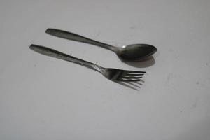 Photo of a silver spoon on a white background