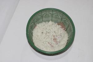 photo of white rice in a green container