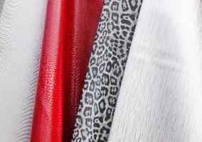 Samples of cloth and fabrics in different colors found at a fabrics market in Germany photo