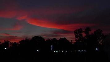 Red pink glow sky scene during evening twilight. Dark maroon sky scene 4k video. video