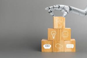 hand touch robot artificial intelligence wood cube with AI symbols Futuristic technology photo
