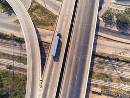 Aerial view of cargo Truck on highway road with blue container, transportation concept.,import,export logistic industrial Transporting Land transport on the asphalt expressway photo