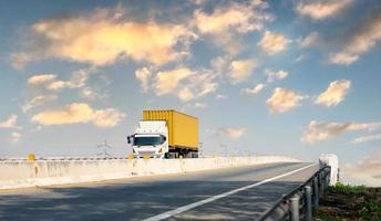 Truck on highway road with yellow container, transportation concept.,import,export logistic industrial Transporting Land transport on the expressway photo