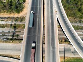 Aerial view of cargo Truck on highway road with blue container, transportation concept.,import,export logistic industrial Transporting Land transport on the asphalt expressway photo