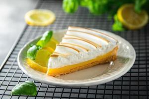 lemon tart meringue sweet dessert ready to eat healthy meal food snack on the table copy space food background rustic top view photo