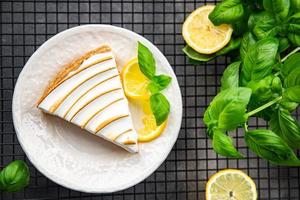 lemon tart meringue sweet dessert ready to eat healthy meal food snack on the table copy space food background rustic top view photo