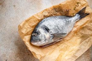 fresh fish sea bream seafood raw food snack on the table copy space food background rustic top view photo