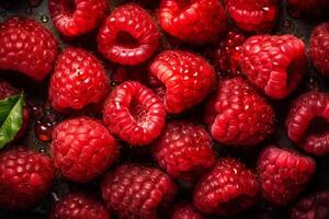 Fresh red raspberries are covered with water droplets. Raspberry background. photo