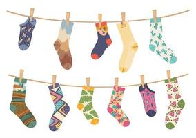 Socks on rope. Cotton sock with cute pattern hanging and drying on laundry ropes. Various funny socks with clothespins vector illustration