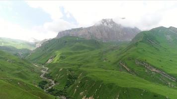 Aerial view of the magnificent mountainous terrain surrounded by lush greenery video