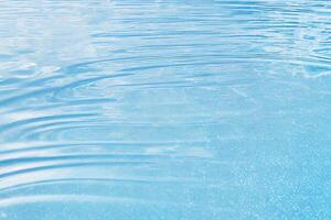 The blue water surface with reflection and . photo