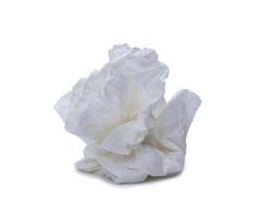 Single screwed or crumpled tissue paper or napkin in strange shape after use in toilet or restroom isolated on white background with clipping path photo