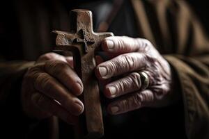 Church priest holds religious cross in hands. photo