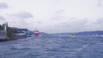 Ships advancing in the Bosphorus. Ships sailing through the strait in the city. video