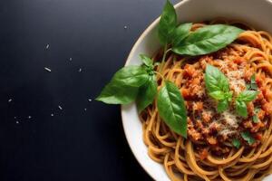 Spaghetti pasta with parmesan cheese and parsley on a plate. photo