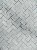 Stone block paving. Paving slabs of gray color as a background. Texture of paving block. photo