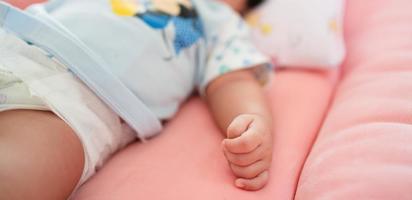 Soft focus newborn baby hand photo