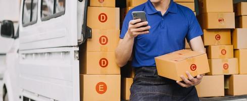 Business woman start up small business entrepreneur SME success .freelance woman working at home with Online Parcel delivery. SME and packaging deliveryconcept photo