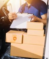 Business woman start up small business entrepreneur SME success .freelance woman working at home with Online Parcel delivery. SME and packaging deliveryconcept photo