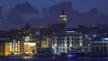 Galata tower and buildings from the sea. Istanbul city. Sea view of mosque and ferry in the city. Istanbul city of Turkey. video