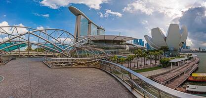 Panoramic view along Helix Bridge at Marina Bay in Singapore photo