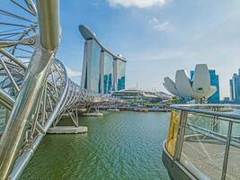 Panoramic view along Helix Bridge at Marina Bay in Singapore photo